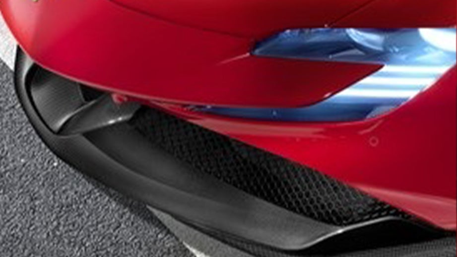 Front headlight close-up of a Ferrari SF90 Stradale