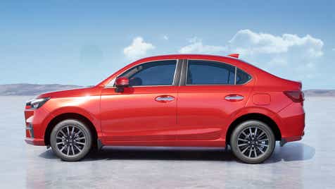 side view of a Radiant Red Metallic Honda Amaze