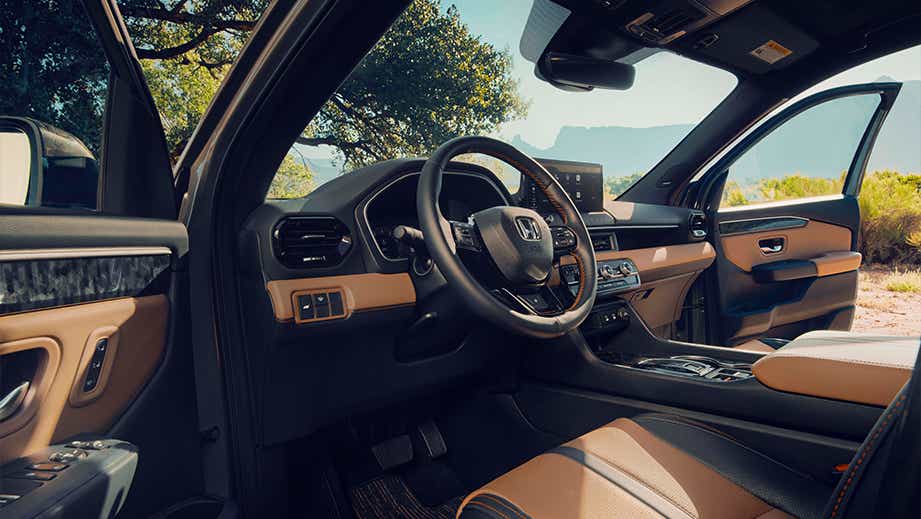Interior dashboard and driver seat view of a Honda Passport