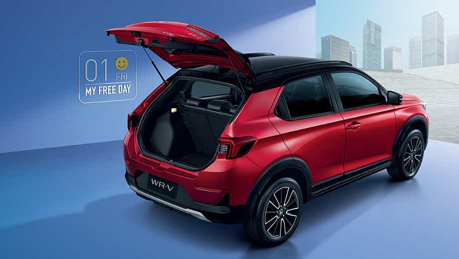 Rear three-quarter view of a Ignite Red Metallic Honda WR-V with open boot