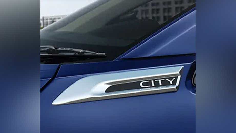 Close-up of a Honda City badge near the windshield
