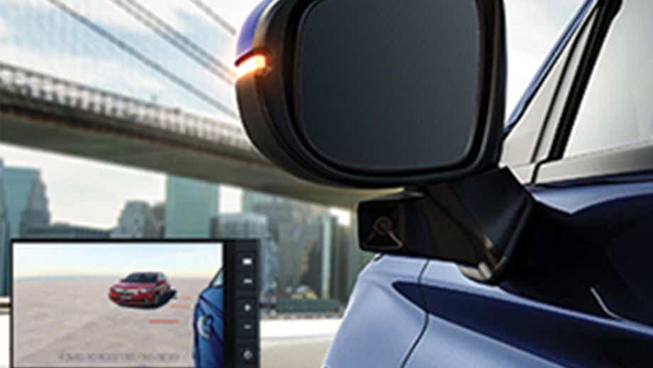 Close-up of side mirror and camera on a Honda City