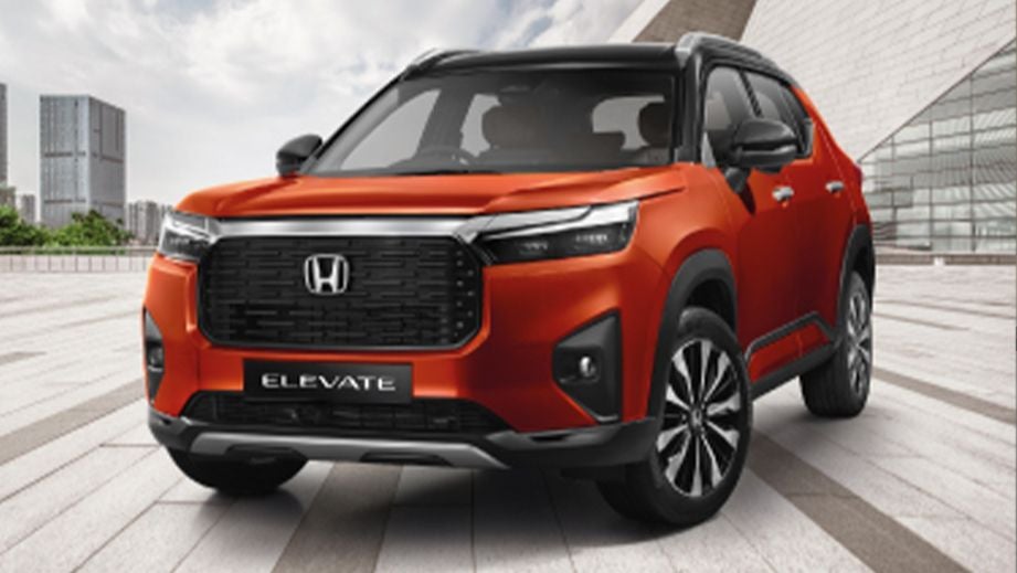 front three-quarter of a Phoenix Orange Pearl Honda Elevate