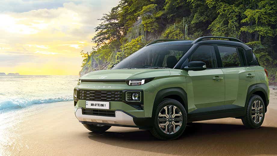 front three-quarter view of a Hyundai Exter on a beach