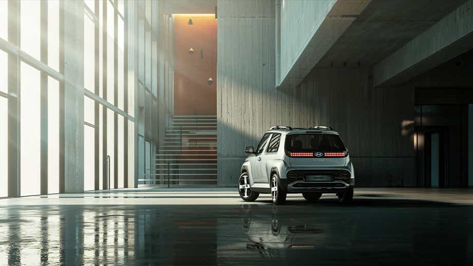 rear view of a Hyundai Inster EV parked indoors