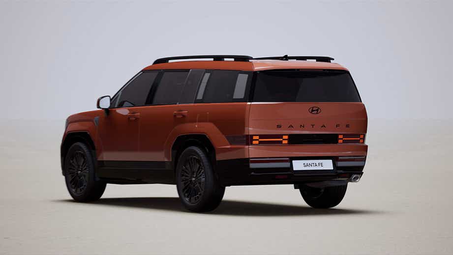 Rear three-quarter view of a Earthy Brass Matte Hyundai New Santa Fe