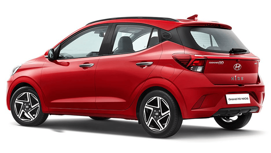 rear three-quarter of a Fiery Red Hyundai Grand i10 Nios