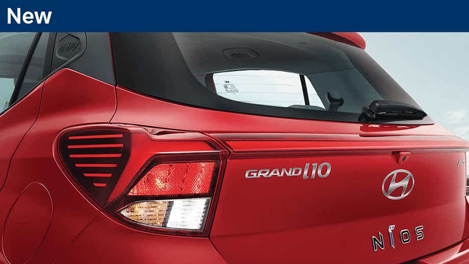 Rear view of a Fiery Red Hyundai Grand i10 Nios