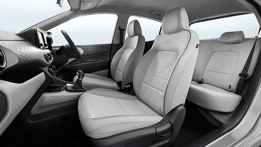 interior dashboard and front seats of a Hyundai Grand i10 Nios
