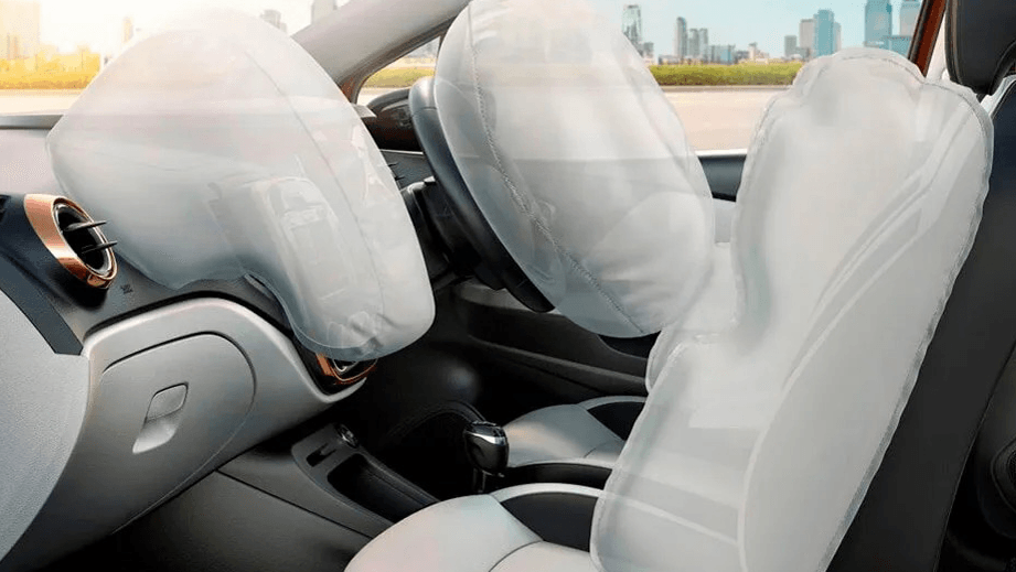 Front interior view of a Hyundai Tucson with airbags deployed