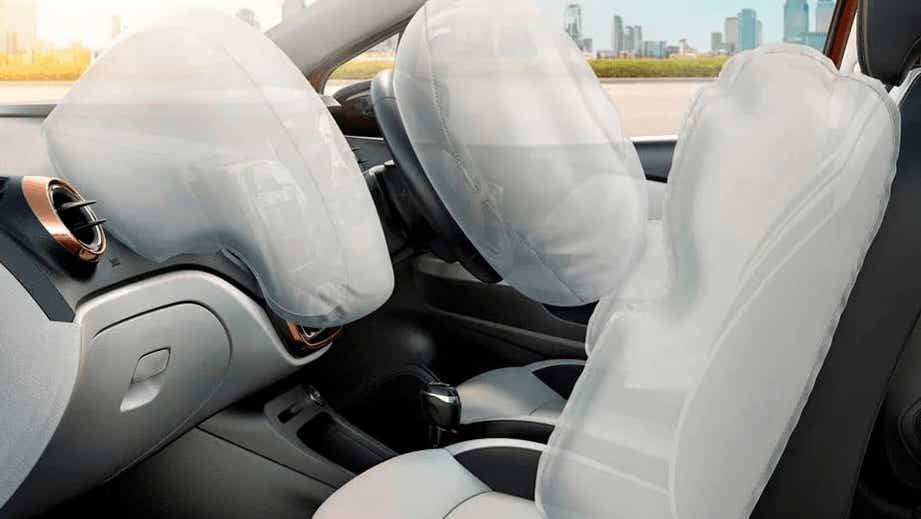 Front interior view of a Hyundai Tucson with airbags deployed
