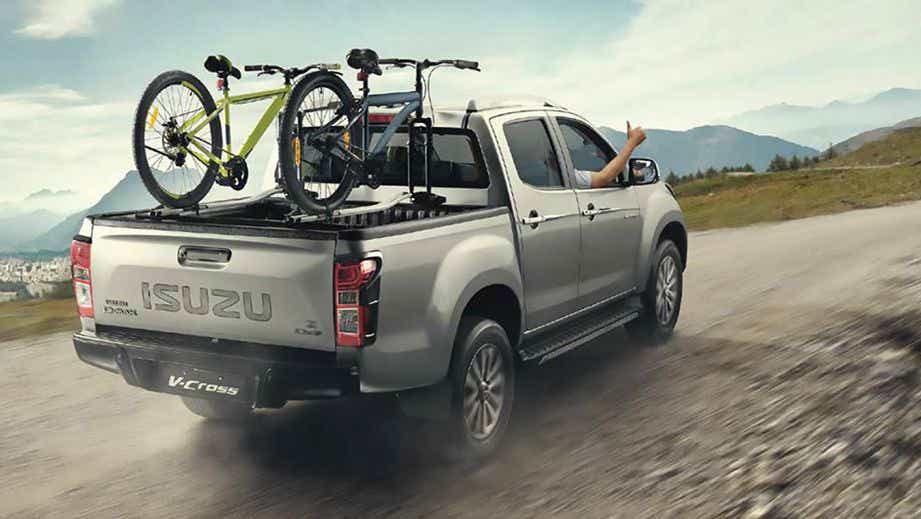 rear three-quarter view of a Silver Metallic Isuzu V-Cross