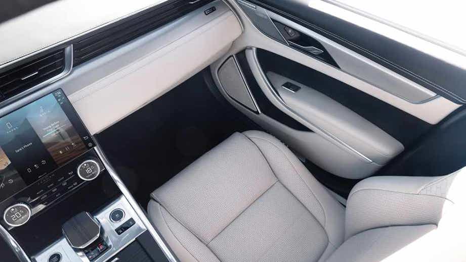 interior dashboard and passenger seat of a Jaguar XF
