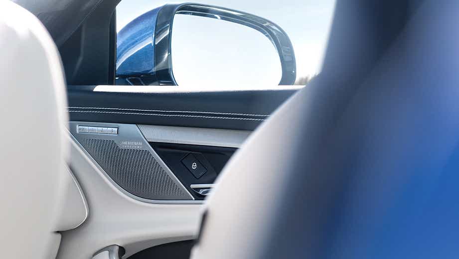 Front door panel and side mirror of a Jaguar XF