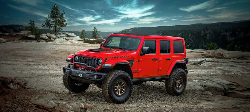 front three-quarter view of a FireCracker Red Jeep Wrangler