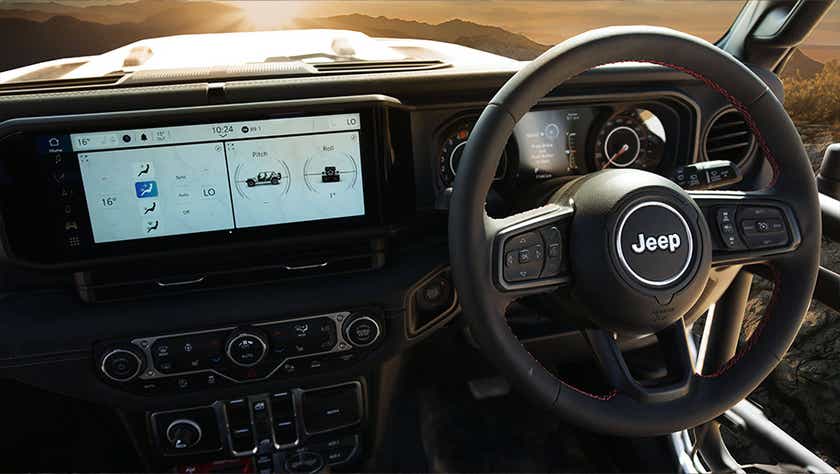 Interior dashboard and steering wheel of a Jeep Wrangler