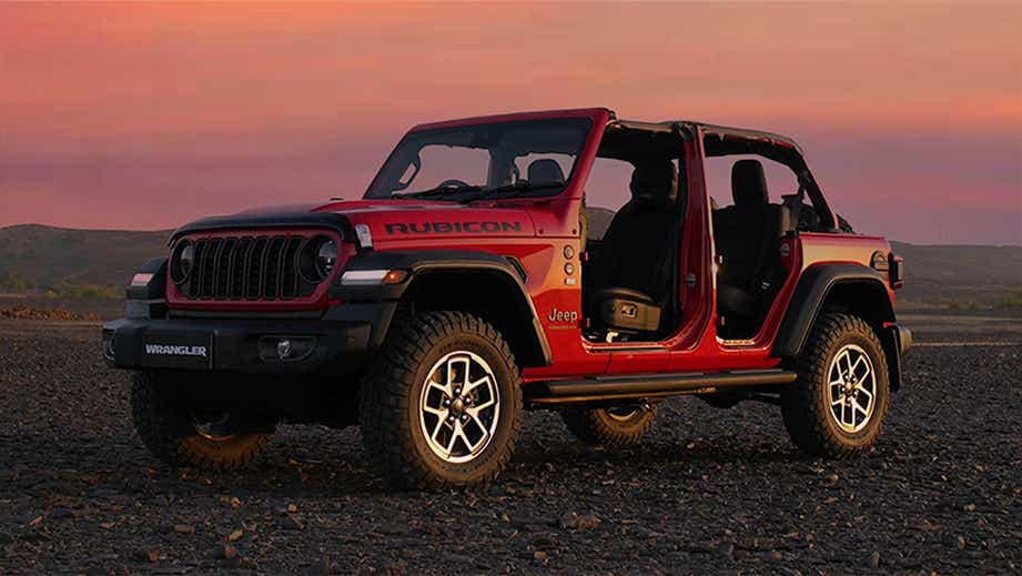 Front-side view of a FireCracker Red Jeep Wrangler Rubicon with doors removed