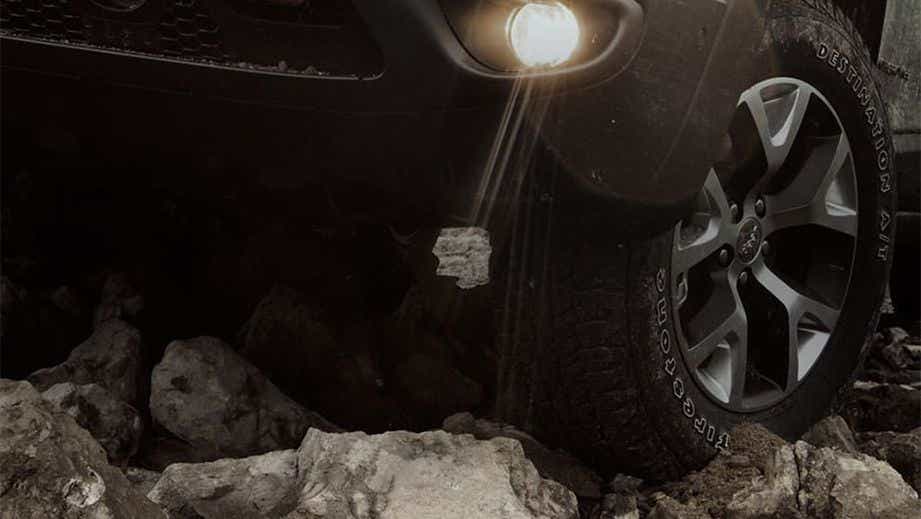 Front wheel and headlight close-up of a Jeep Compass
