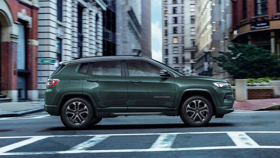 side view of a Jeep Compass on a city street