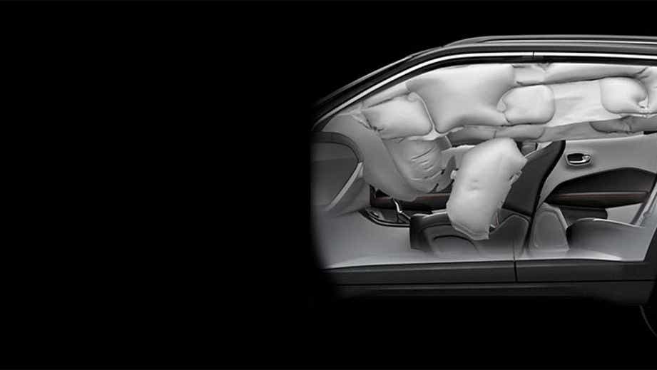 side interior view of a Jeep Compass with deployed airbags
