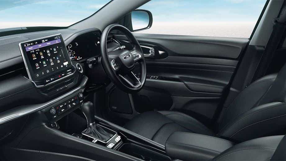 Interior dashboard and front seats of a Jeep Compass