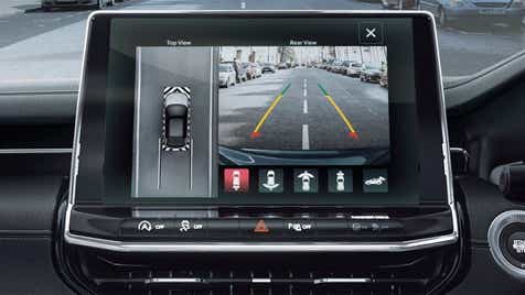 Interior dashboard display showing parking camera on a Jeep Compass