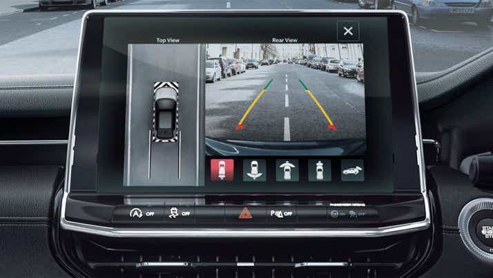 Interior dashboard display showing parking camera on a Jeep Compass