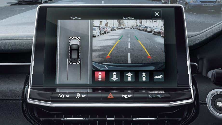 Interior dashboard display showing parking camera on a Jeep Compass