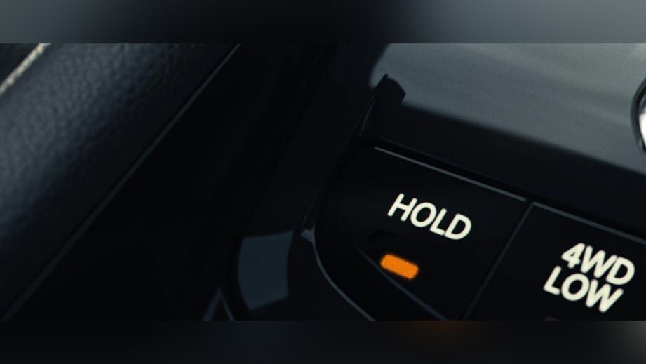 Close-up of 4WD control buttons in a Jeep Compass