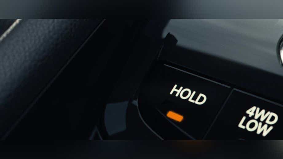 Close-up of 4WD control buttons in a Jeep Compass