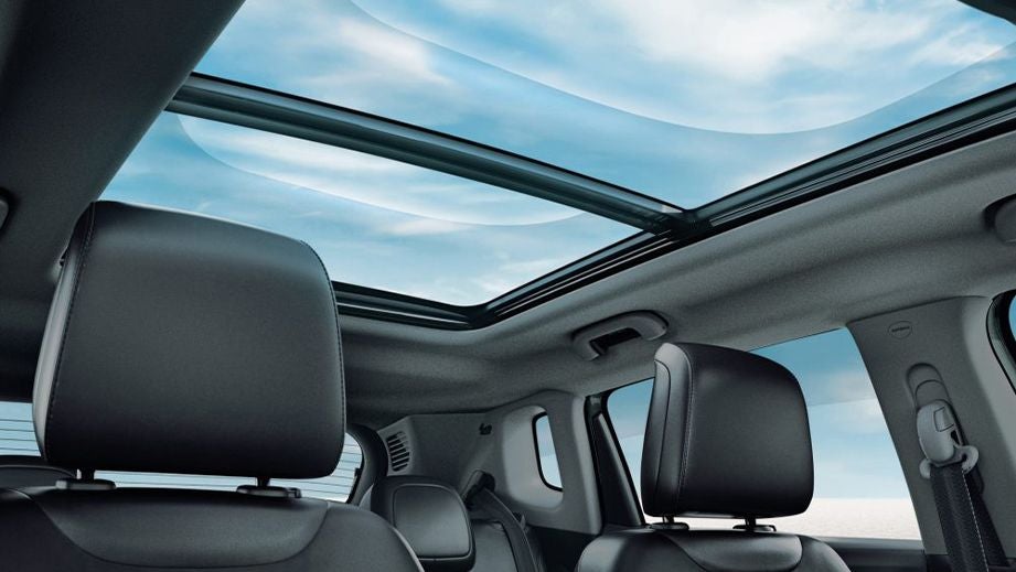 Panoramic sunroof interior view of a Jeep Compass