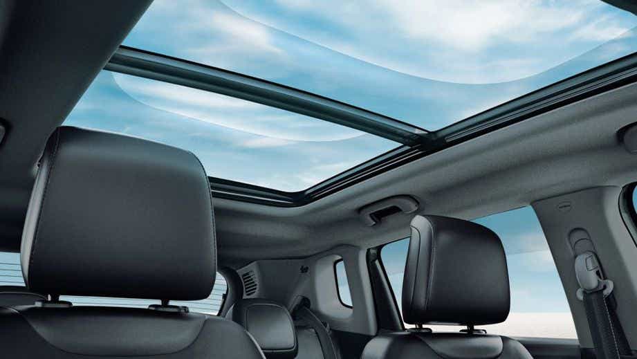 Panoramic sunroof interior view of a Jeep Compass