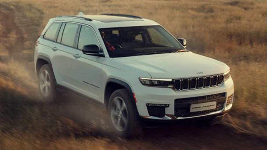 front three-quarter view of a Bright White Jeep Grand Cherokee