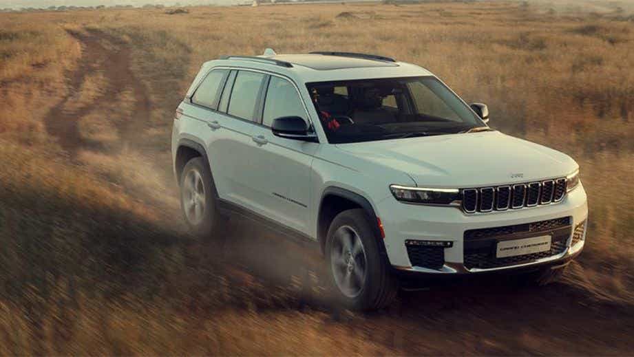 front three-quarter view of a Bright White Jeep Grand Cherokee