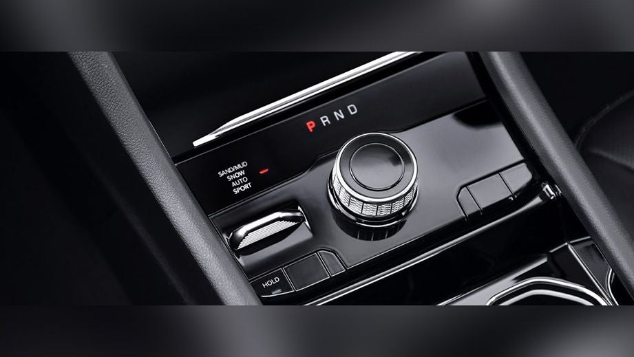 Center console gear selector and drive mode controls of a Jeep Grand Cherokee