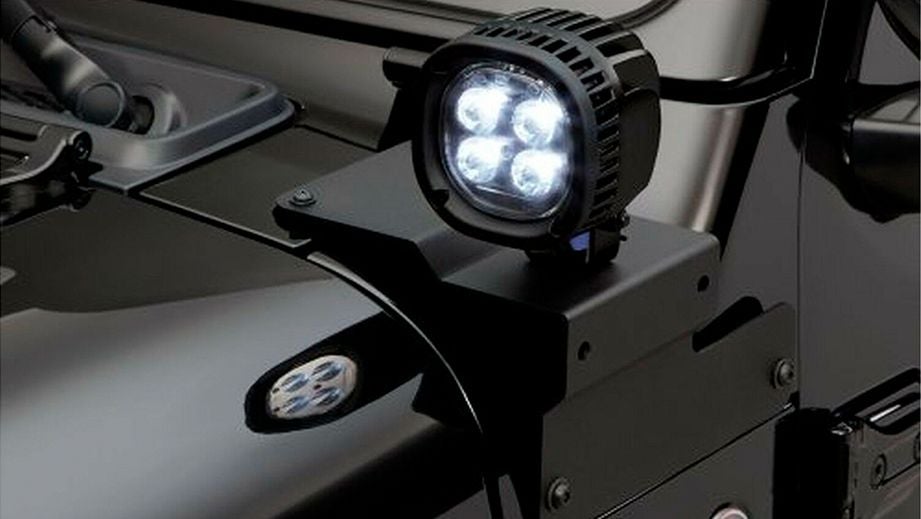 Close-up of a headlight on a Jeep Wrangler 2021-2023