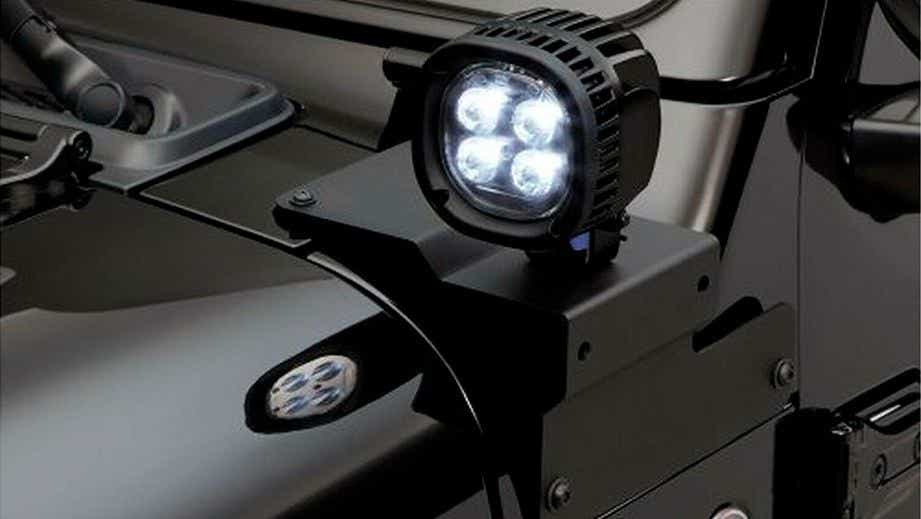 Close-up of a headlight on a Jeep Wrangler 2021-2023