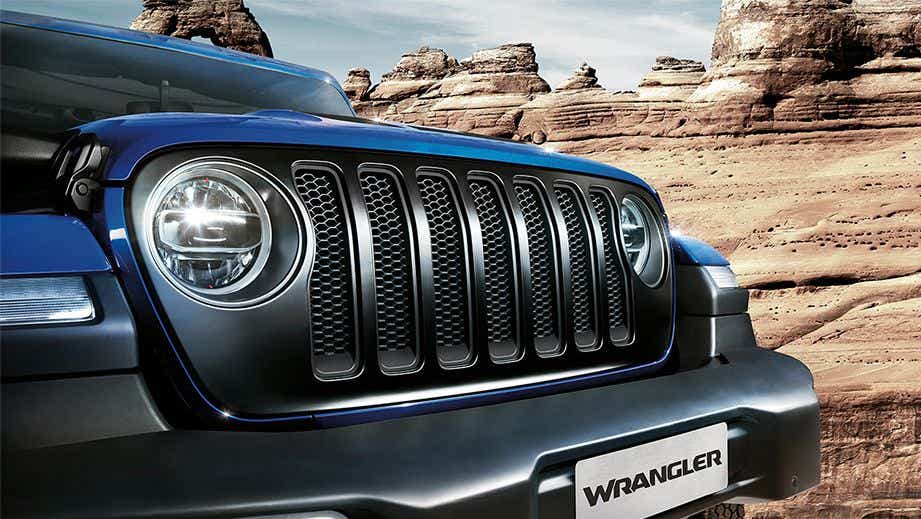 Front grille and headlight close-up of a Jeep Wrangler 2021-2023