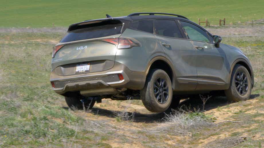 rear three-quarter view of a Black Kia Sportage