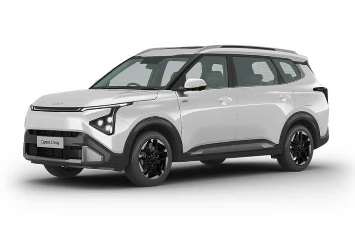 front three-quarter of a Glacier White Pearl Kia Carens Clavis