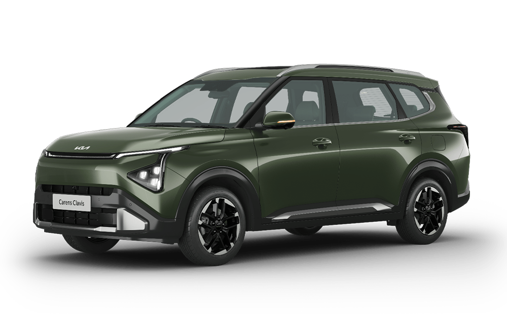 front three-quarter view of a Pewter Olive Kia Carens Clavis