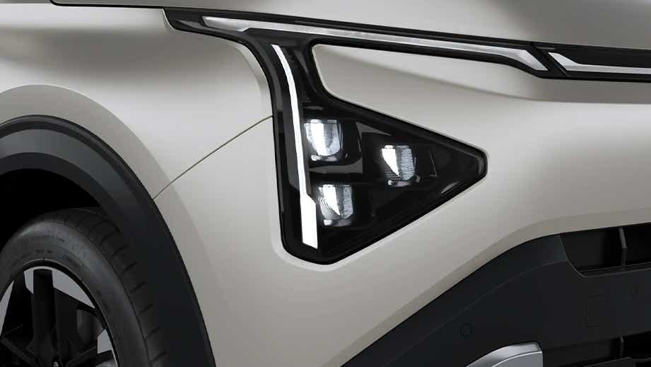 Headlight close-up of a Kia Carens Clavis