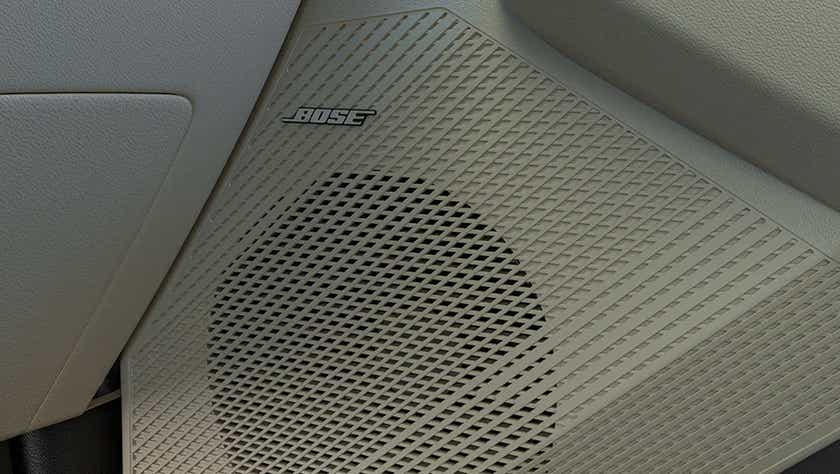 Interior speaker close-up of a Kia Carens Clavis featuring Bose audio system