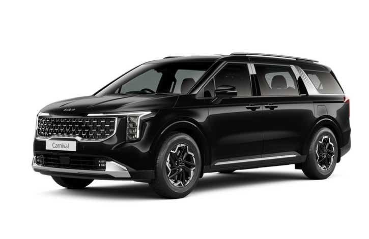 front three-quarter view of a Fusion Black Kia Carnival