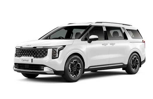 front three-quarter view of a Glacier White Pearl Kia Carnival