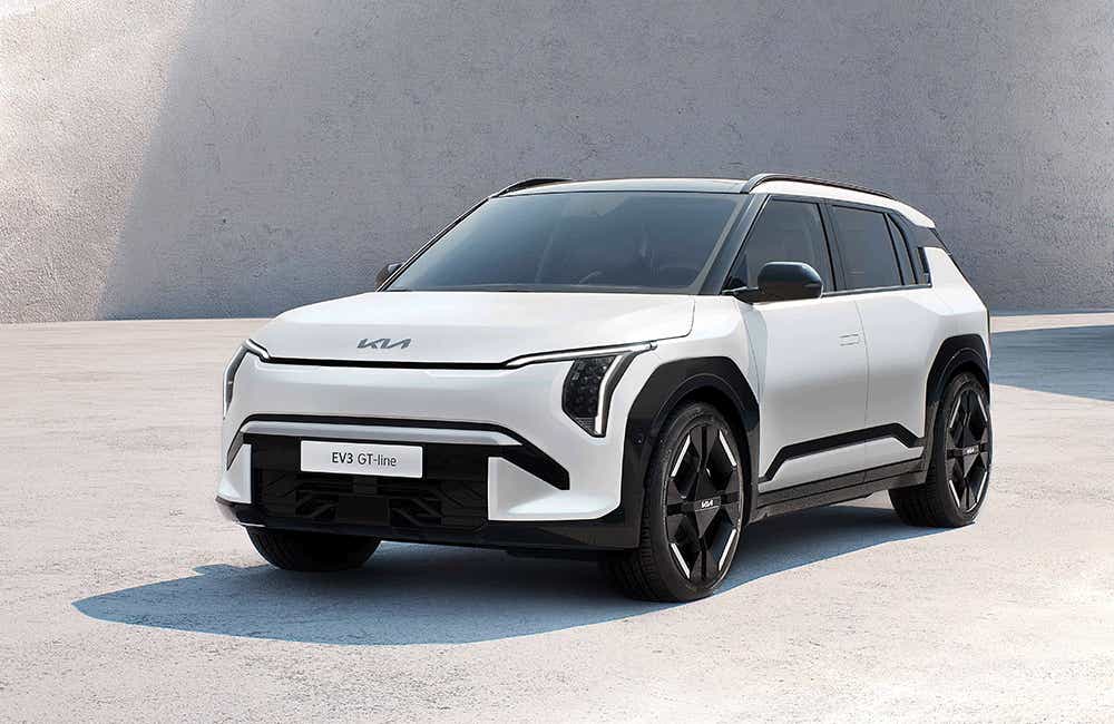 front three-quarter view of a Glacier White Pearl Kia EV3