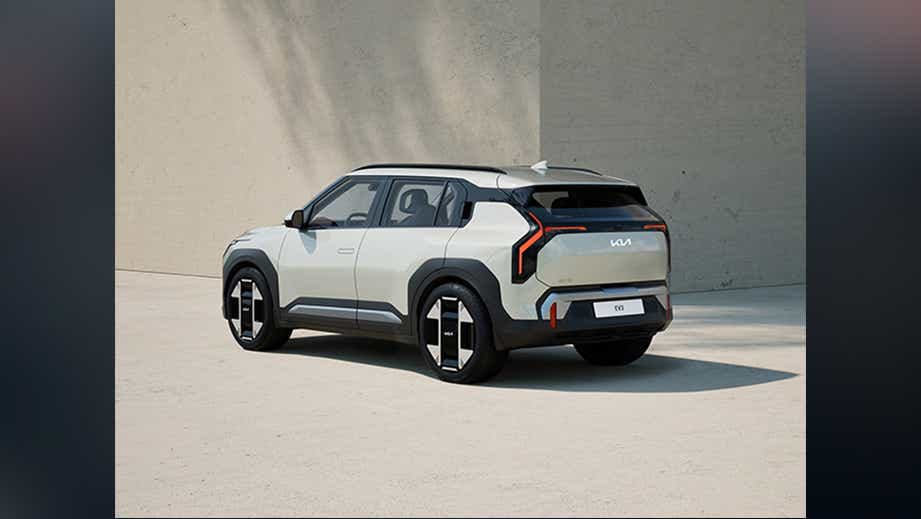 rear three-quarter view of a Glacier White Pearl Kia EV3