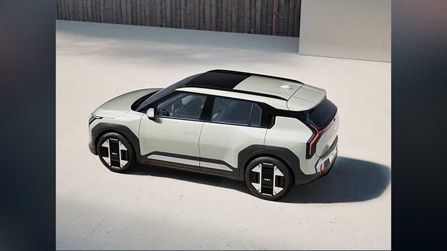 high-angle side view of a Glacier White Pearl Kia EV3