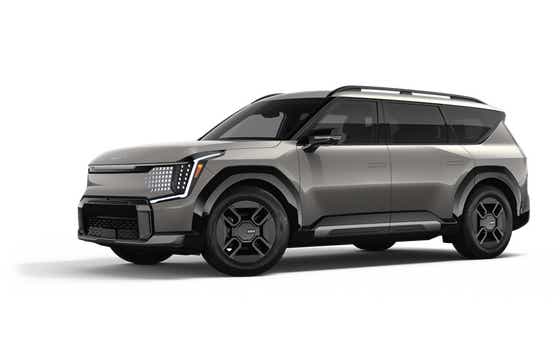 front three-quarter view of a Pebble Gray Kia EV9