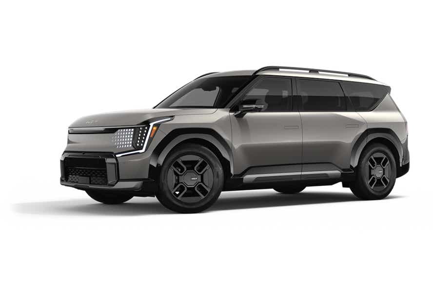 front three-quarter view of a Pebble Gray Kia EV9